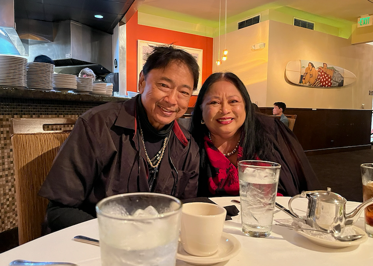 Pancho and Jenny sitting together at a restaurant