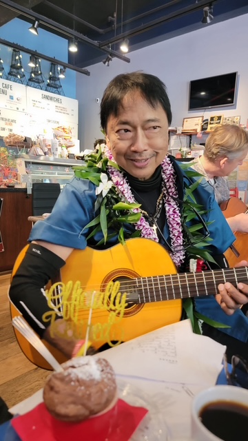 Pancho Cordero Delos Santos playing guitar